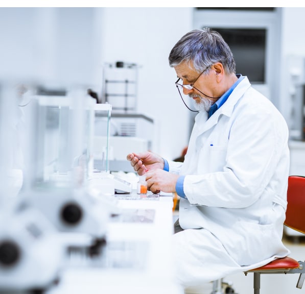 Scientist examining a sample while working in a laboratory